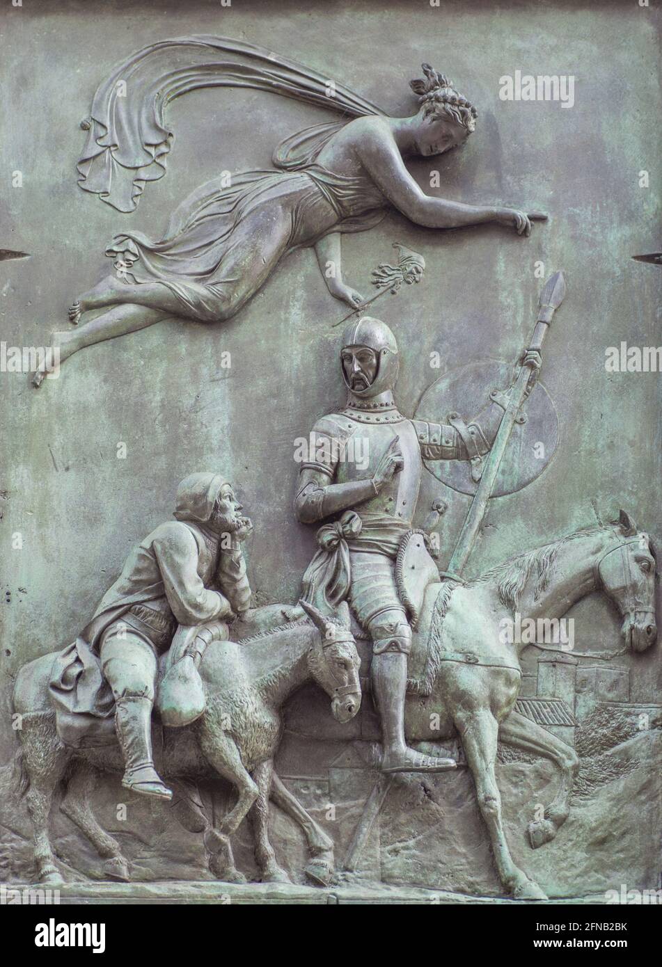 Bronze-Reliefs mit Don Quixote-Szene. Von Jose Piquer Duart, 1835. Don Quixote und Sancho Panza, die von der Göttin des Wahnsinns getrieben werden Stockfoto