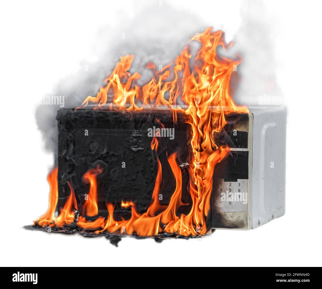 Mikrowellenofen brennt, Hausbrand aufgrund von unsachgemäßem Betrieb, spontane Verbrennung fehlerhafter Geräte isoliert Stockfoto