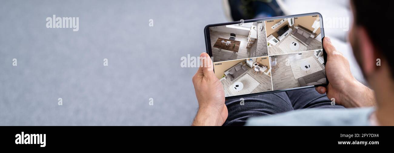 Sicherheitssystem CCTV Video Spy Cameras on Tablet Stockfoto