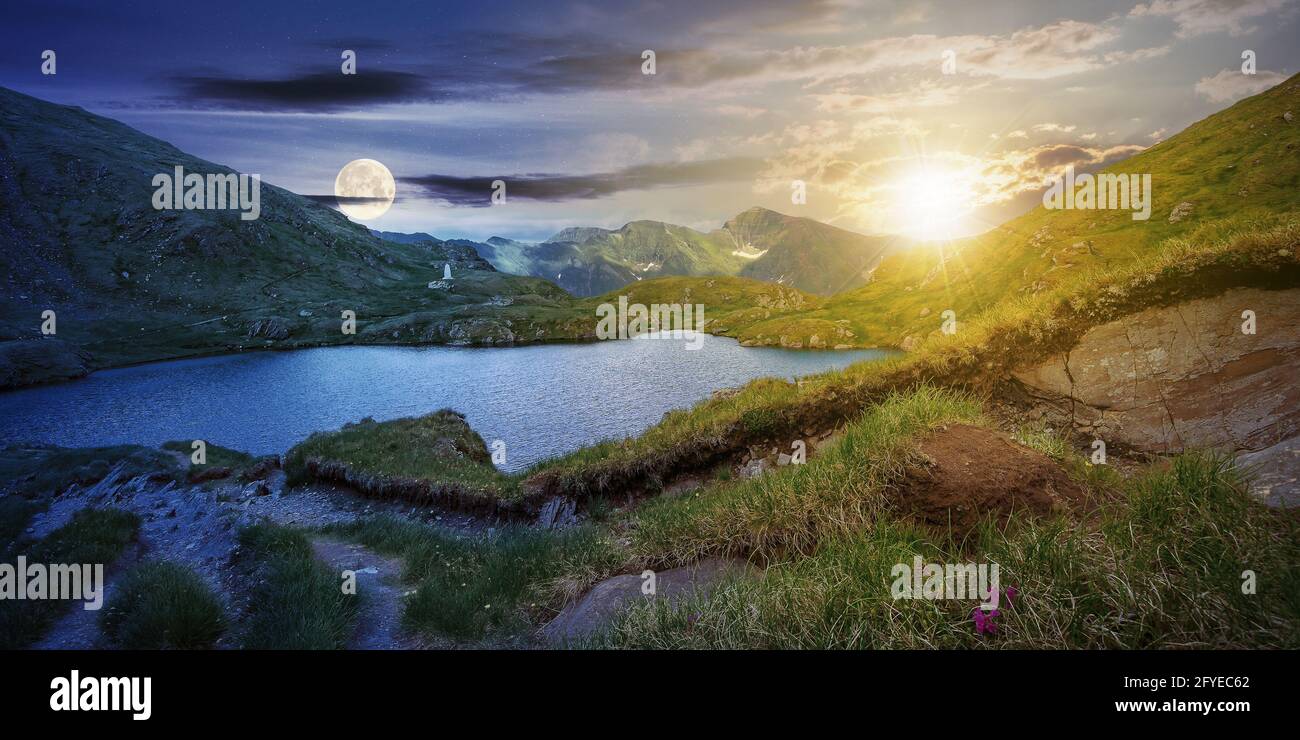 Tag- und Nachtwechsel Konzept über Sommerlandschaft mit See auf hoher Höhe. Schöne Landschaft des fagaras Bergrückens. Offener Blick in die Stockfoto