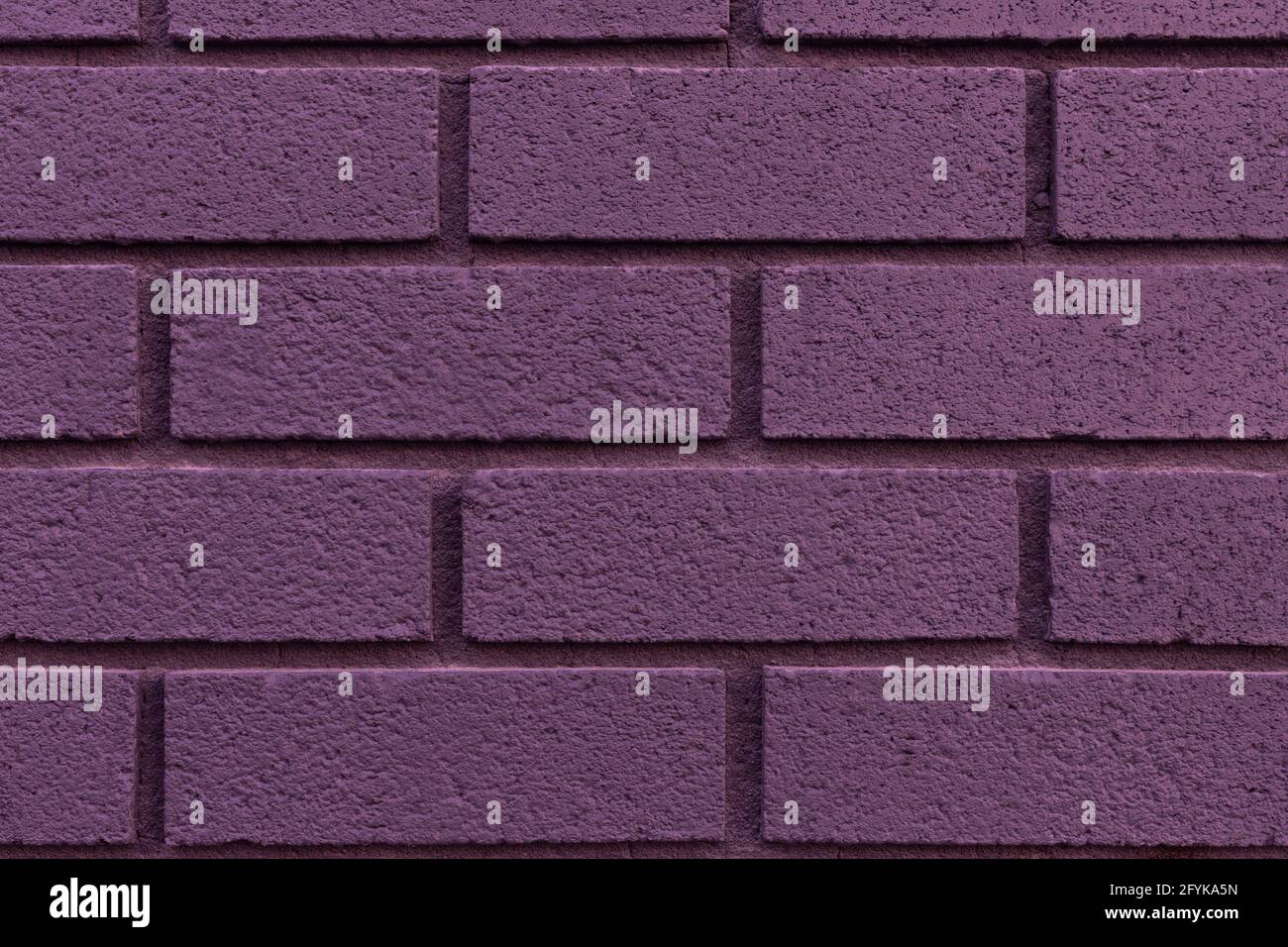 Nahaufnahme von gemalten lila Backstein Wand Textur Hintergrund. Stockfoto