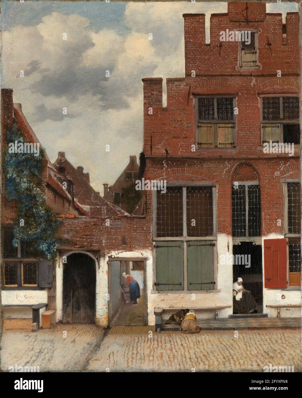 Blick auf die Häuser in Delft, bekannt als die kleine Straße. Dies ist ein ungewöhnliches Gemälde in Vermeers Werk, das für seine Zeit als Porträt gewöhnlicher Häuser bemerkenswert ist. Die Komposition ist ebenso spannend wie ausgeglichen. Die alten Mauern mit ihren Ziegeln, Weißbruch und Rissen sind fast greifbar. Der Standort ist Vlamingstraat 40–42 in Delft. Vermeers Tante Ariaentgen Claes wohnte mit ihren Kindern von etwa 1645 bis zu ihrem Tod im Jahr 1670 im Haus rechts. Stockfoto