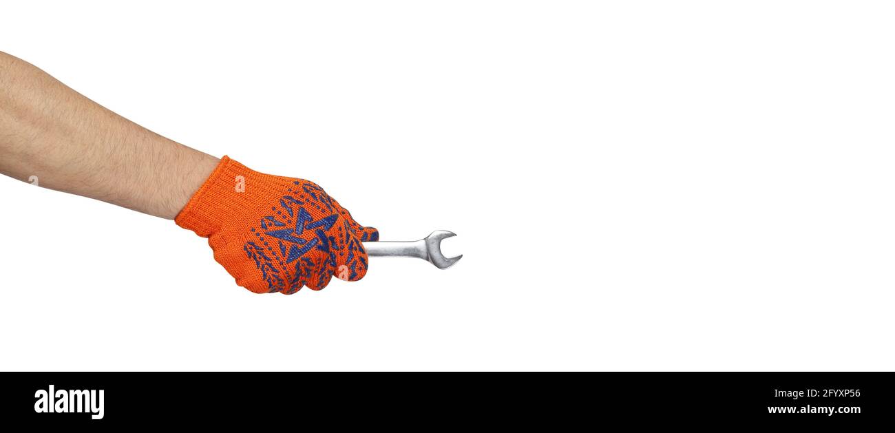 Werkzeuge Hände Aktion - Hand in Arbeit Handschuh hält Schlüssel isoliert weißen Hintergrund. Stockfoto