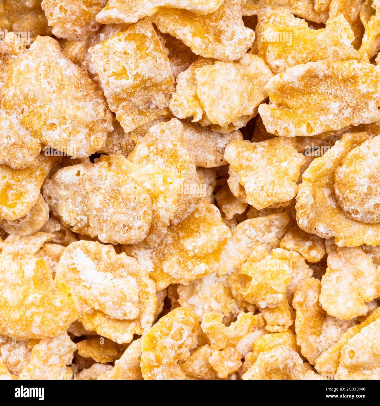 Quadratische Lebensmittel Hintergrund - Rohzucker beschichtete Cornflakes aus nächster Nähe Stockfoto