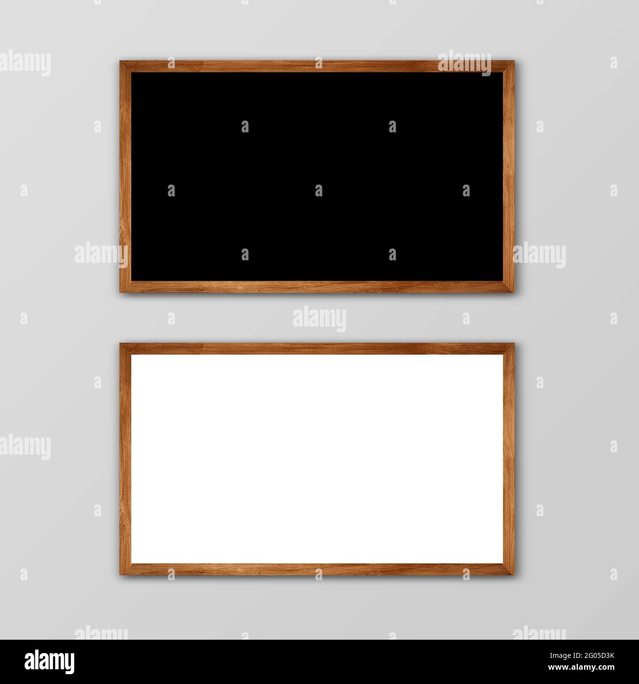 Zwei horizontale Rahmen auf grauer Wand mit Holzrahmen. 2 rechteckiger Rahmen in grauer Wand hängen . Ein braunes Holz Black Blank und ein weißes Holz Rohling. Stockfoto