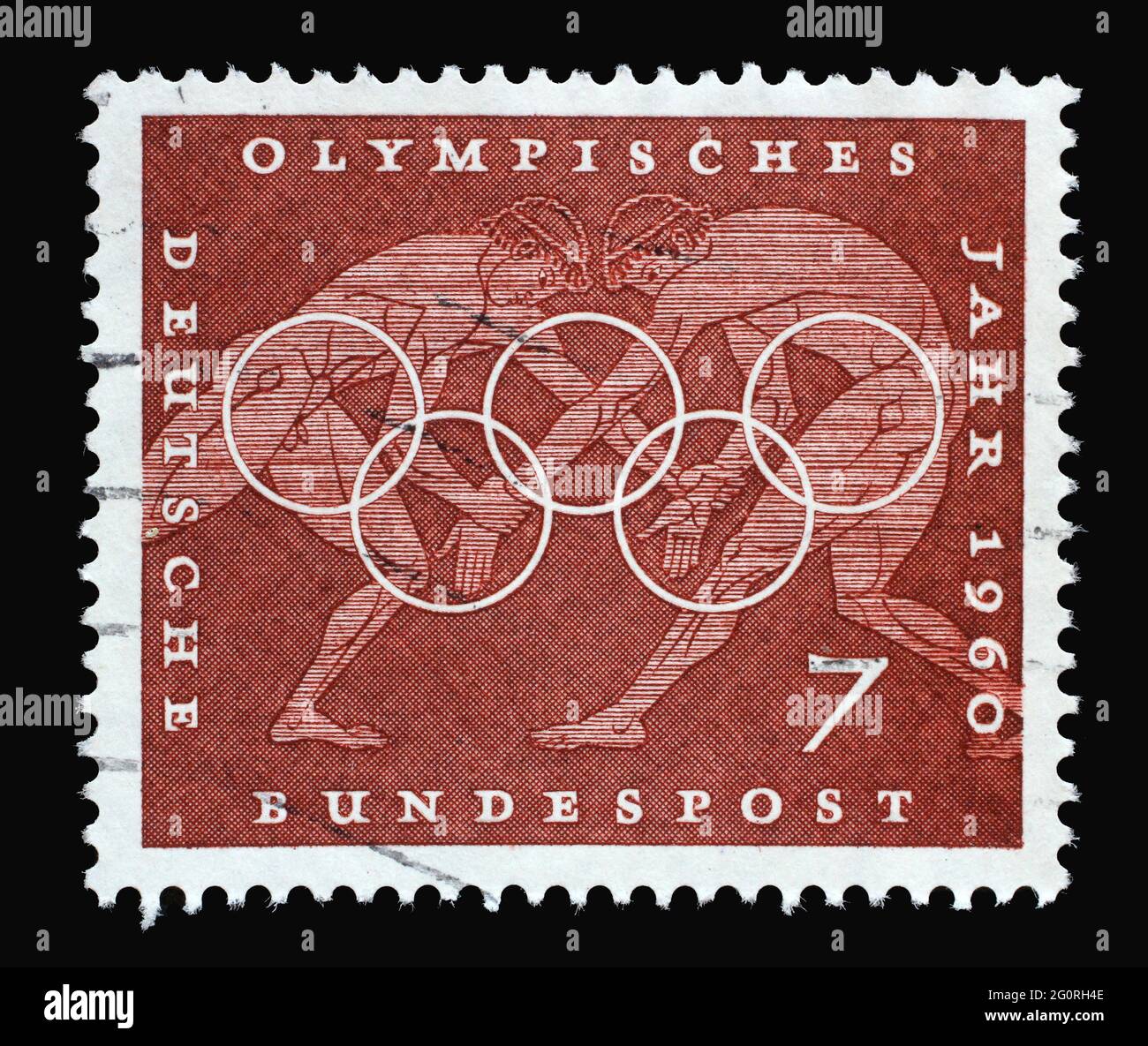 In Deutschland gedruckte Marke mit Wrestling, Sportszene aus griechischen Vasenbildern, olympischen Ringen und zur Förderung der 17. Olympischen Spiele in Rom, um 1960 Stockfoto