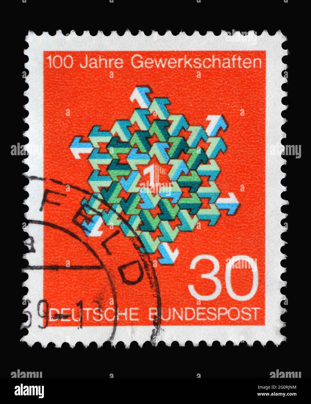 In Deutschland gedruckte Marke mit grünen und weißen Pfeilen in verschiedenen Richtungen, 100 Jahre Deutsche Gewerkschaften, um 1968 Stockfoto