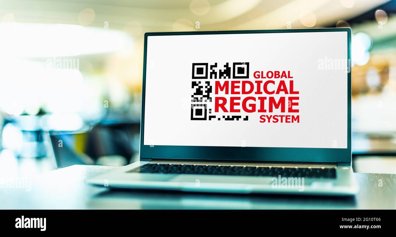 Laptop-Computer mit dem Zeichen eines globalen medizinischen Regimes Stockfoto
