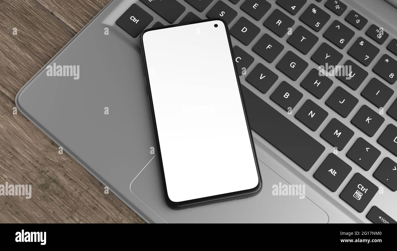 Nachbau eines Mobiltelefons auf einer Laptop-Tastatur. Sie können Ihr Design auf dem Bildschirm platzieren. Ideal für die Präsentation von Web-Designs oder Anwendungen. Stockfoto