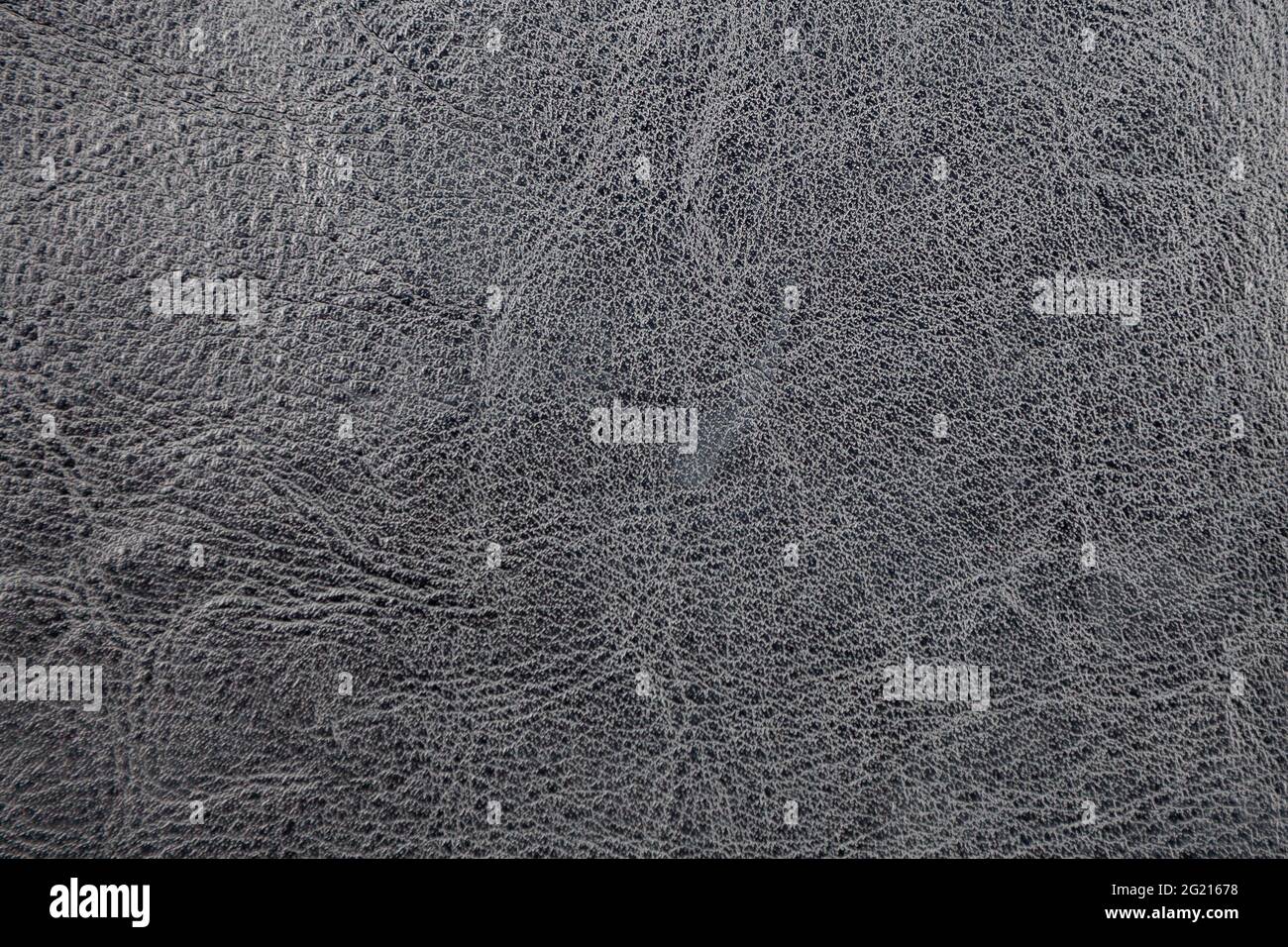 Hintergrundbild - schwarzes Leder mit einer abstrakten Textur. Stockfoto