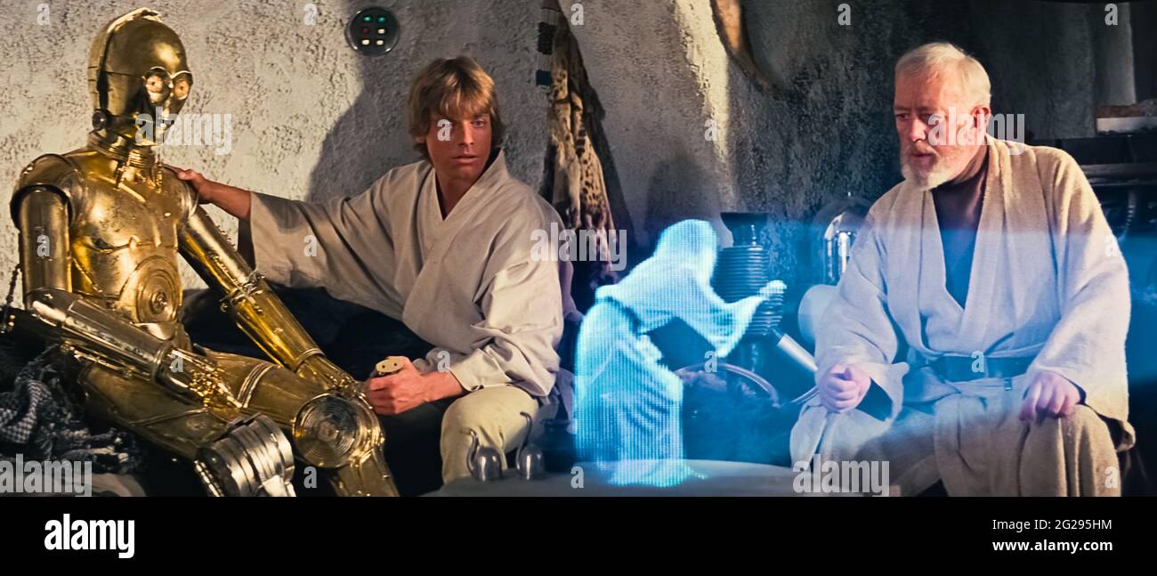 USA. Alec Guinness und Mark Hamill in einer Szene aus dem (C)20th Century Fox Film: Star Wars: Episode IV - A New Hope (1977) . Handlung: Luke Skywalker schließt sich mit einem Jedi-Ritter, einem übermütig Piloten, einem Wookiee und zwei Droiden zusammen, um die Galaxie vor der weltzerstörerischen Kampfstation des Imperium zu retten und gleichzeitig zu versuchen, Prinzessin Leia aus dem geheimnisvollen Darth Vader zu retten. Ref: LMK110-J7164-080621 geliefert von LMKMEDIA. Nur Redaktionell. Landmark Media ist nicht der Urheberrechtsinhaber dieser Film- oder TV-Standbilder, bietet aber nur einen Service für anerkannte Medien an. pictures@lmkmedia.com Stockfoto