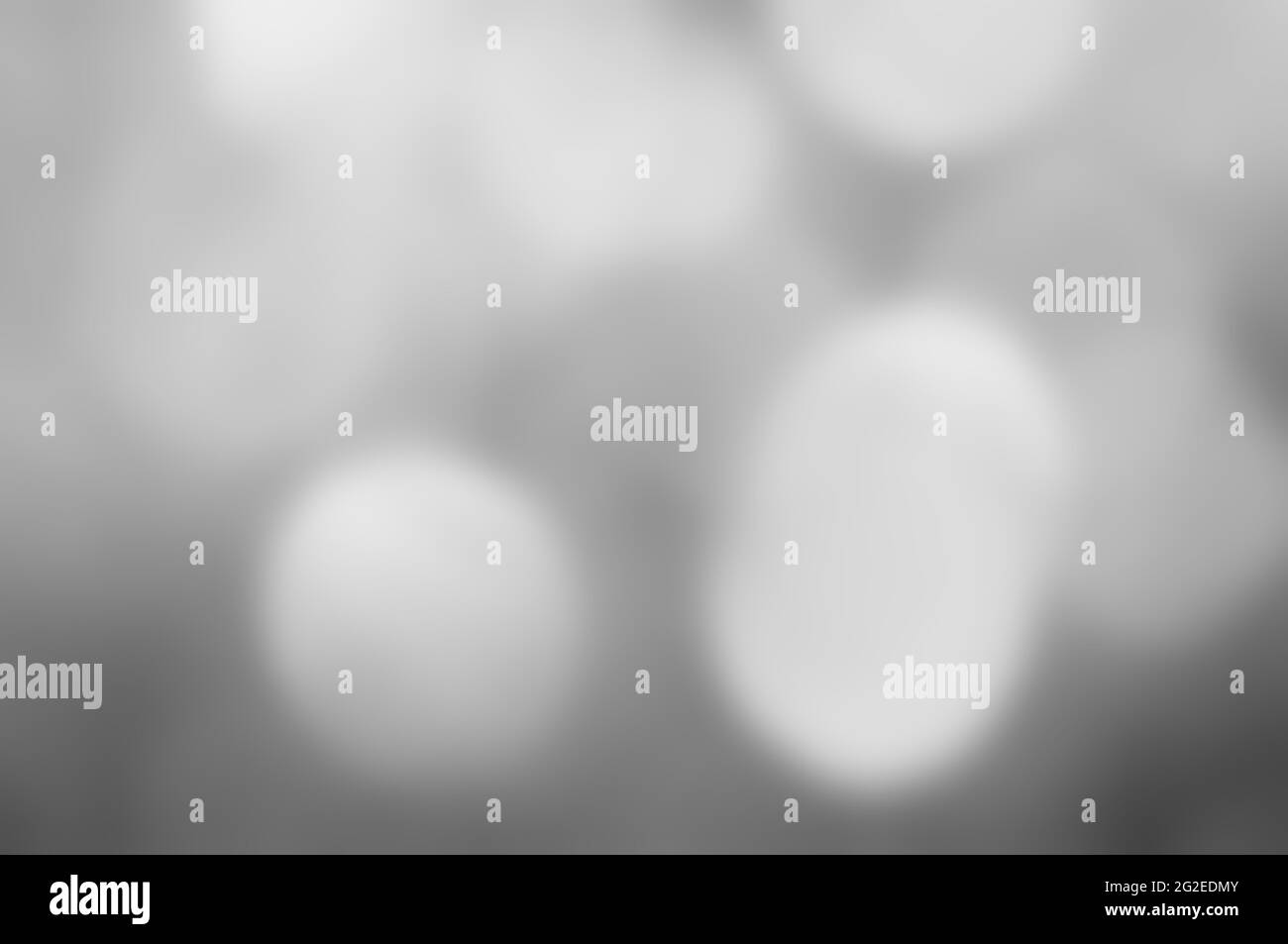 Grauer, abstrakter Hintergrund mit Streulicht Stockfoto