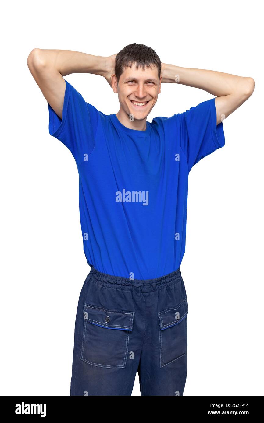 Werbung für Arbeitskleidung. Porträt eines entspannten und positiven Mannes in Arbeitshose und blauem T-Shirt. Isoliert auf weißem Hintergrund. Stockfoto