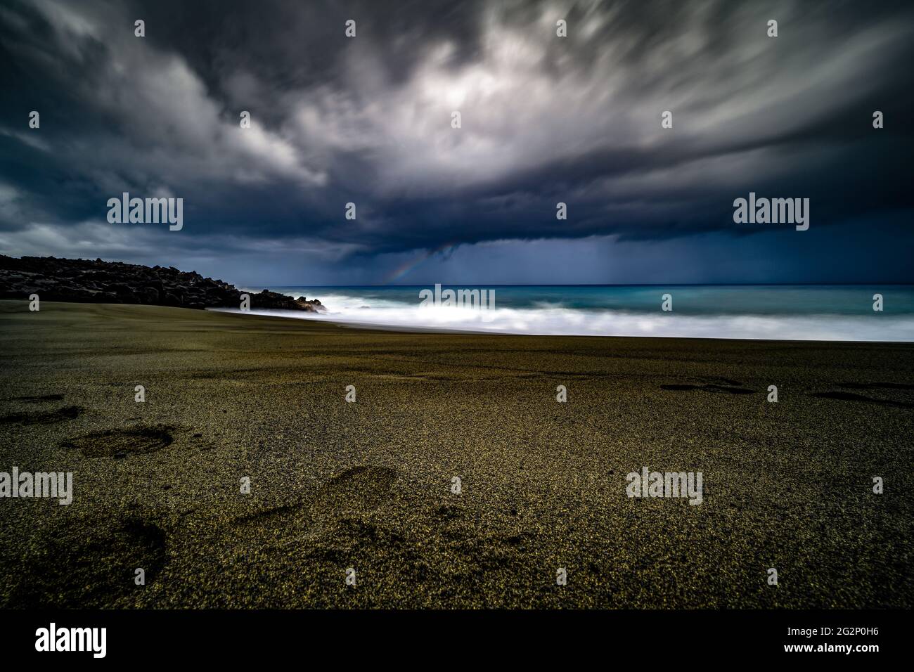 Lavasandstrand Stockfoto