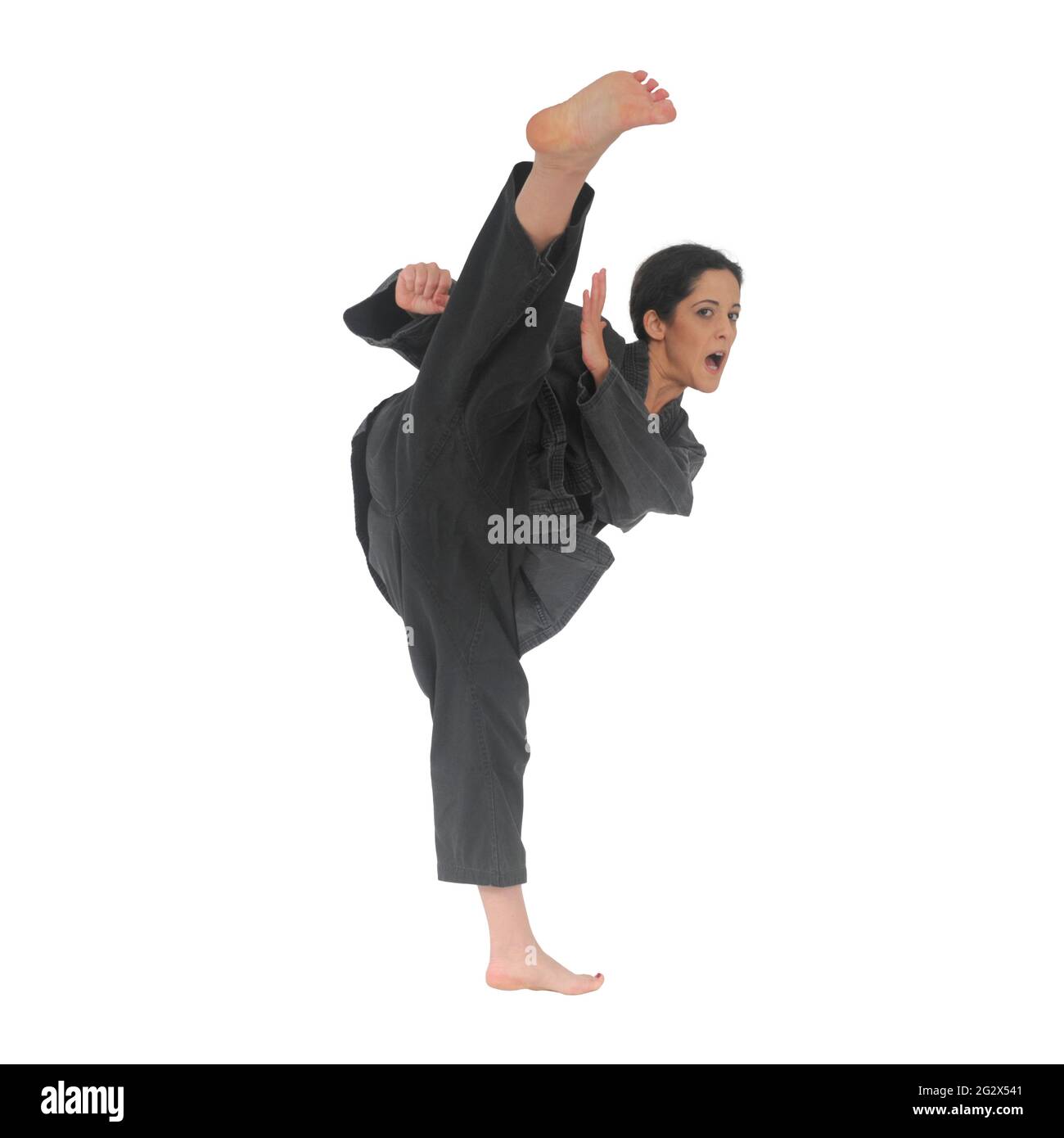 Weibliche Kampfkunst Üben in einem Studio auf weißem Hintergrund Ilan@IlanPhoto.com Stockfoto