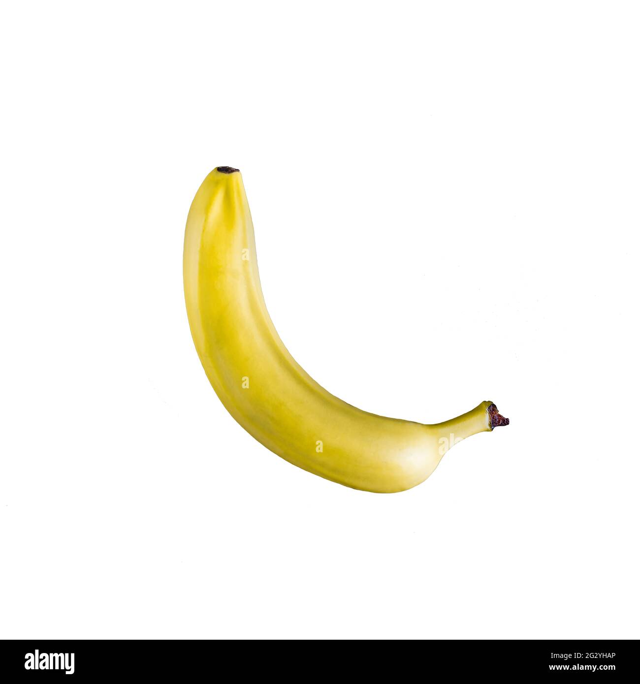 Eine süße, saftige und perfekt schöne Banane auf einem komplett weißen Hintergrund wartet auf Sie. Appetitlich. Nahrhafte Früchte, sehr gesund. Stockfoto