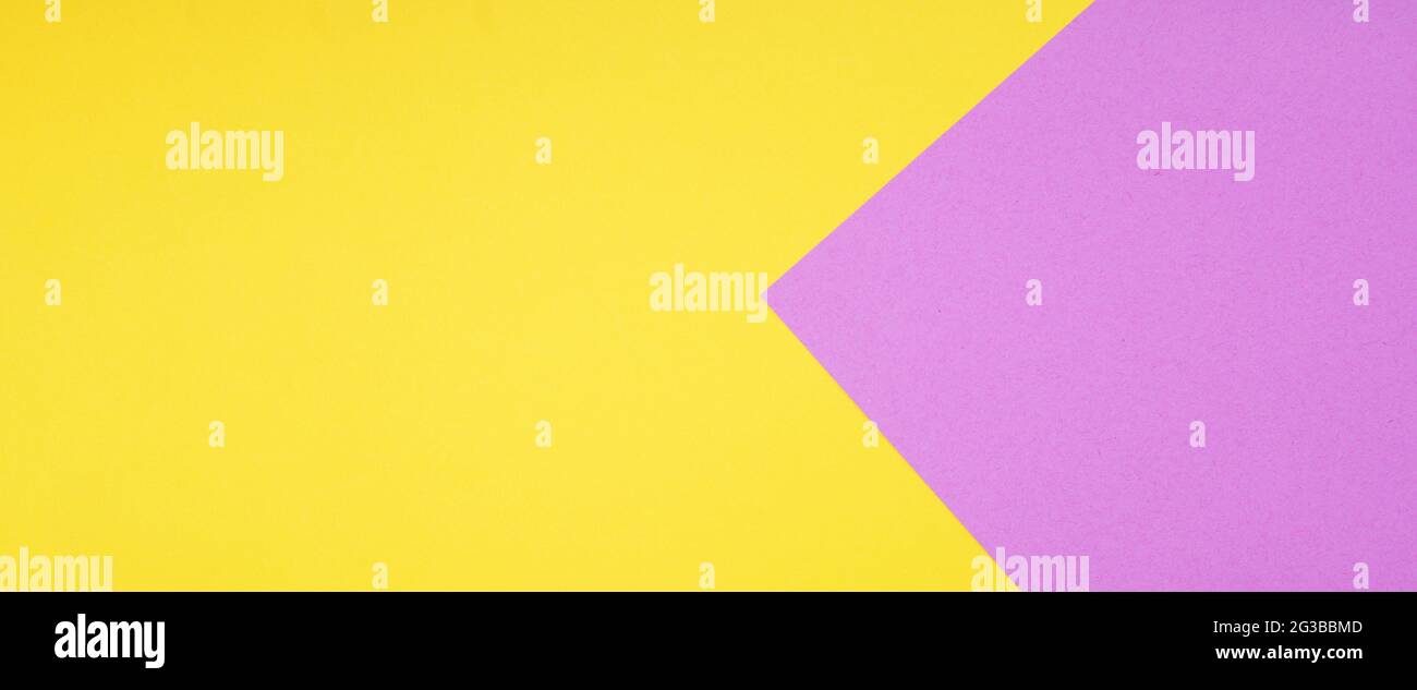 Zweifarbiger Papierhintergrund in Gelb und Rosa im Webbanner-Format Stockfoto