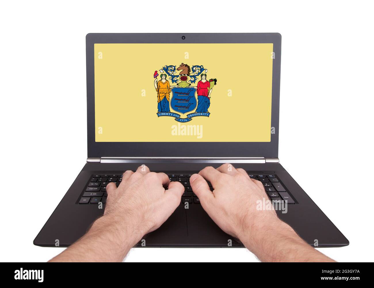 Hände arbeiten auf einem Laptop, New Jersey Stockfoto