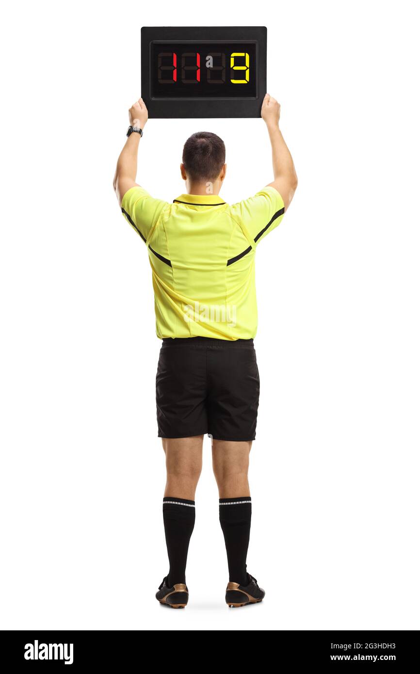 Rückansicht eines Fußballschiedsrichters mit einem auf weißem Hintergrund isolierten Ersatzbrett Stockfoto