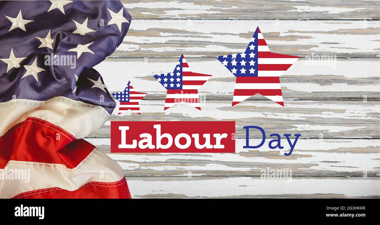 Happy Labor Day Text und Sterne gegen amerikanische Flagge auf Holzhintergrund Stockfoto