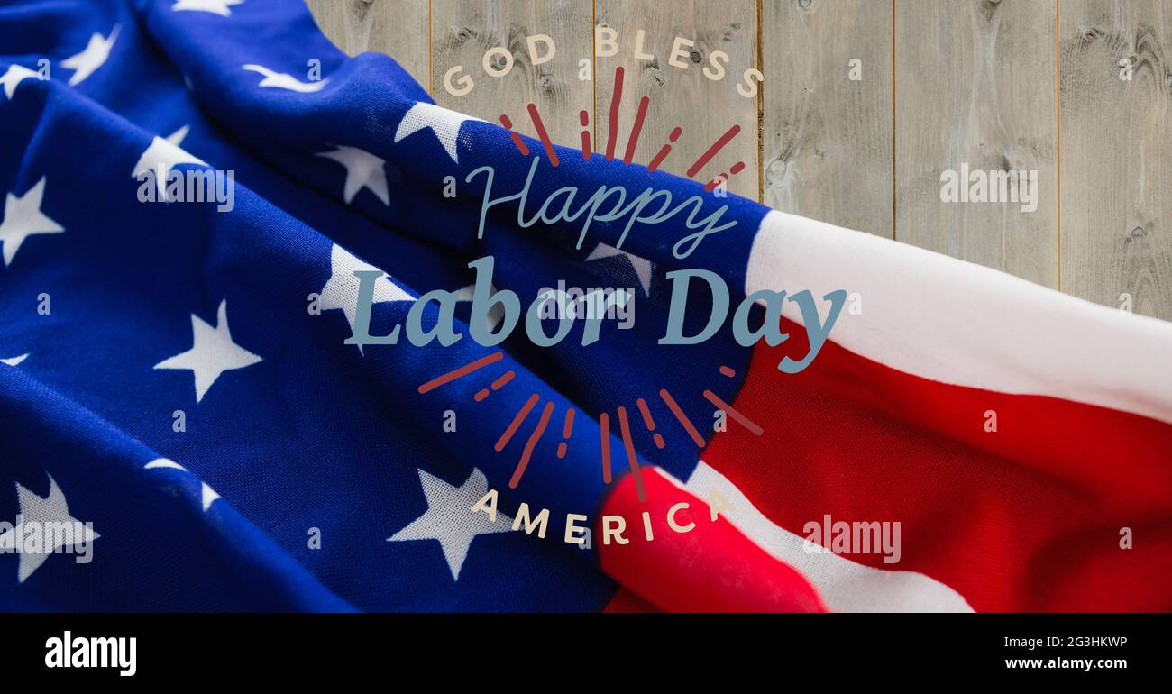 Happy Labor Day Text gegen amerikanische Flagge auf Holzhintergrund Stockfoto