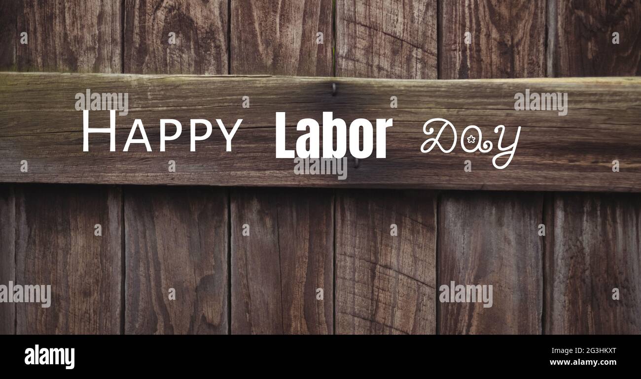 Happy Labor Day Text vor Holzplanke Hintergrund Stockfoto