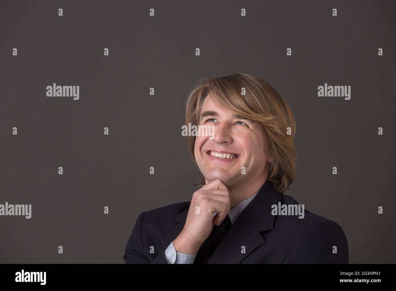 Im mittleren Alter Geschäftsmann lächelnd Stockfoto