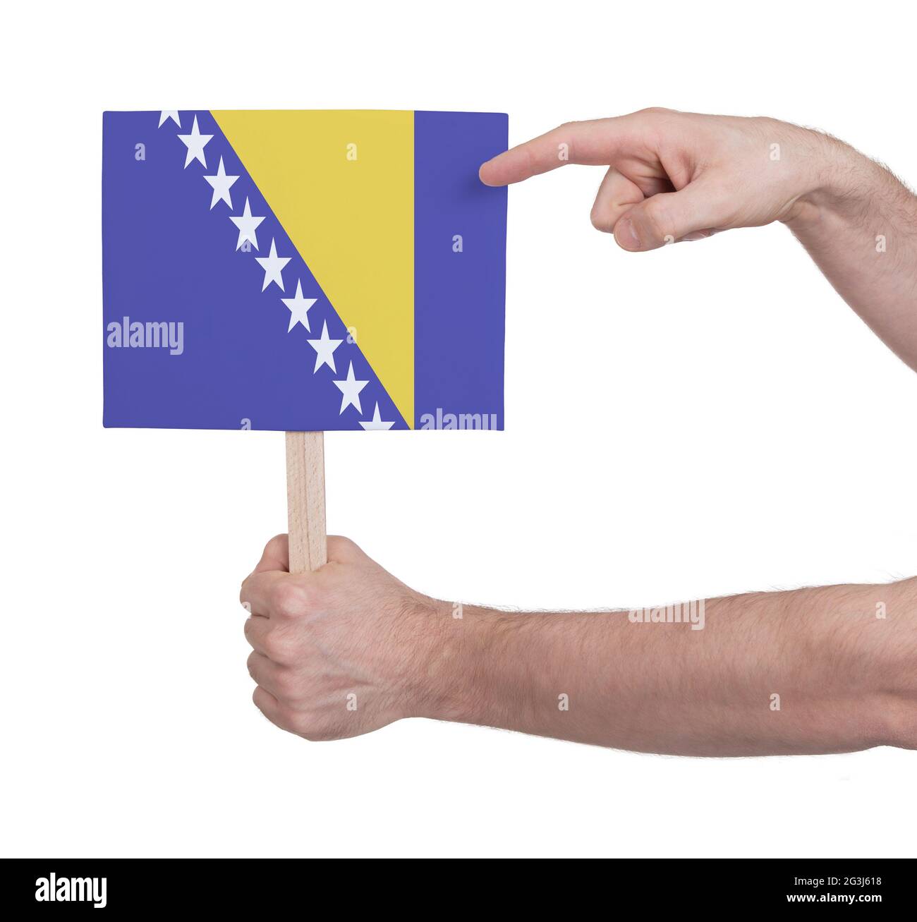 Hand mit kleiner Karte - Flagge von Bosnien-Herzegowina Stockfoto