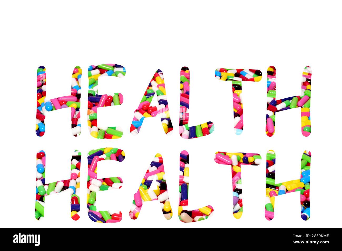 Pillen in Kapseln in Form des Textes Gesundheit auf weißem Hintergrund. Mehrfarbige pharmazeutische Pille, medizinische Tabletten zur Erhaltung und Verbesserung Stockfoto