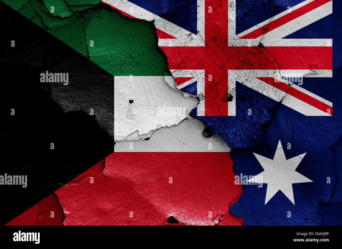 Flaggen von Kuwait und Australien auf rissige Wand gemalt Stockfoto