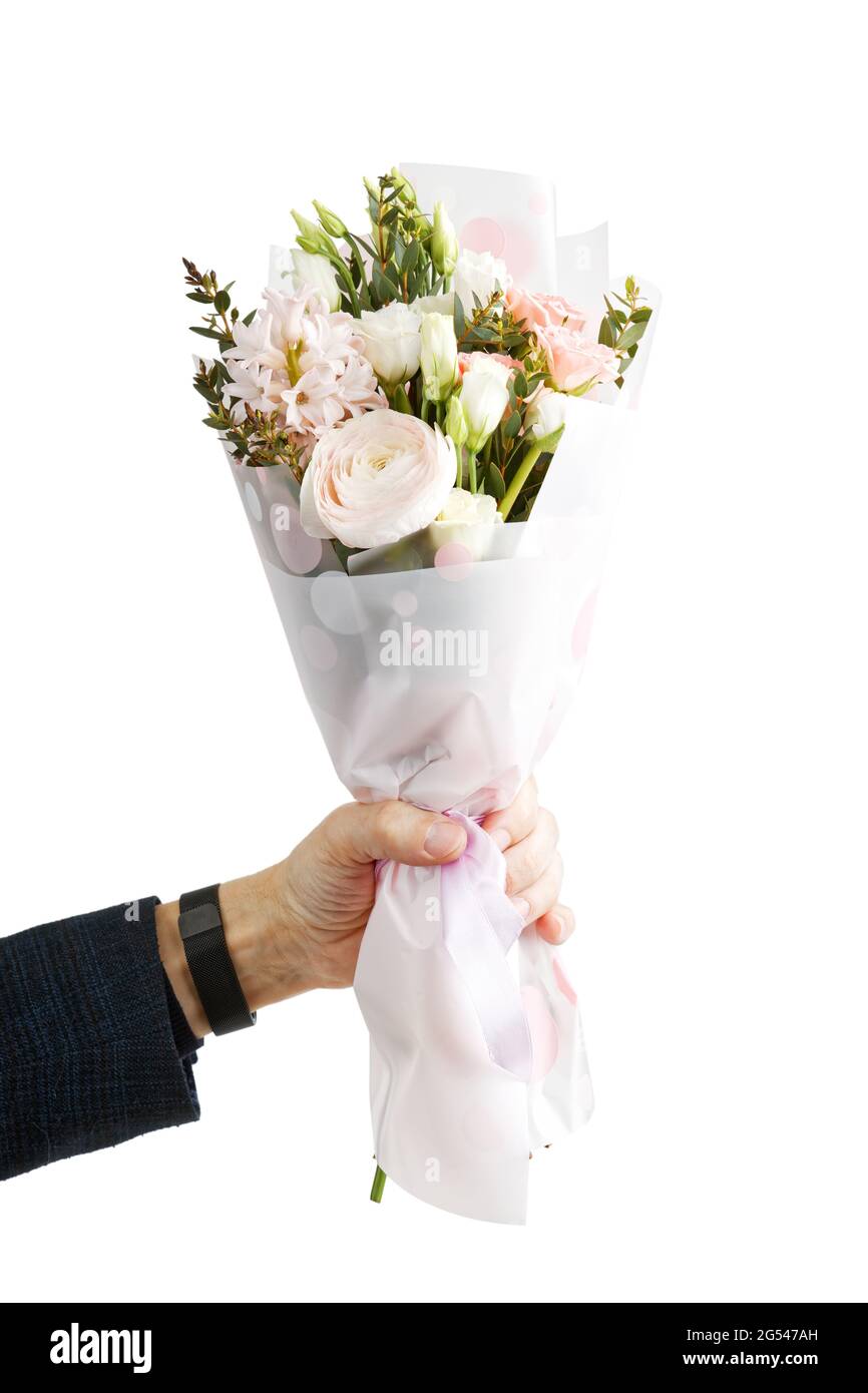 Nahaufnahme mans Hand hält einen Blumenstrauß. Isoliert auf Weiß. Stockfoto