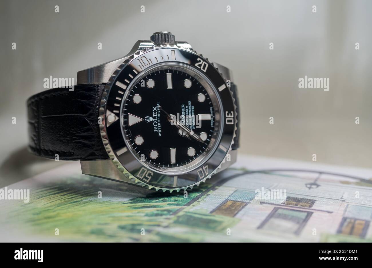 BANGKOK - SEPTEMBER 2 : Rolex submariner no date model with Aligator  leather strap lay on colorful Postcard was taken in Bangkok, Thailand, on  September Stockfotografie - Alamy