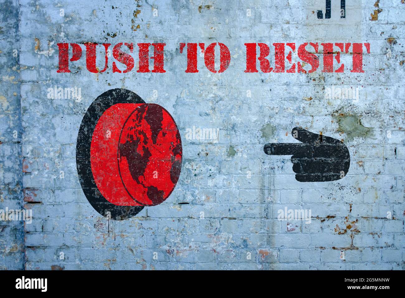Drücken Sie, um Welt-Graffiti auf grungy Wand, das große Reset-Konzept zurückzusetzen Stockfoto