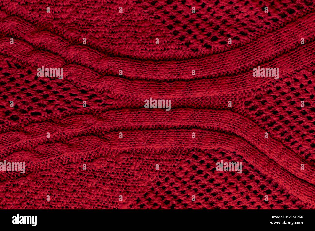 Dunkelrote, burgunderrote Strickstruktur. Rauer Pullover im Hintergrund. Nahaufnahme Stockfoto