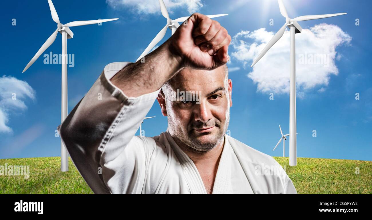 Digitales Composite-Bild des Porträts des kaukasischen männlichen ehelichen Künstlers gegen Windmühlen Stockfoto