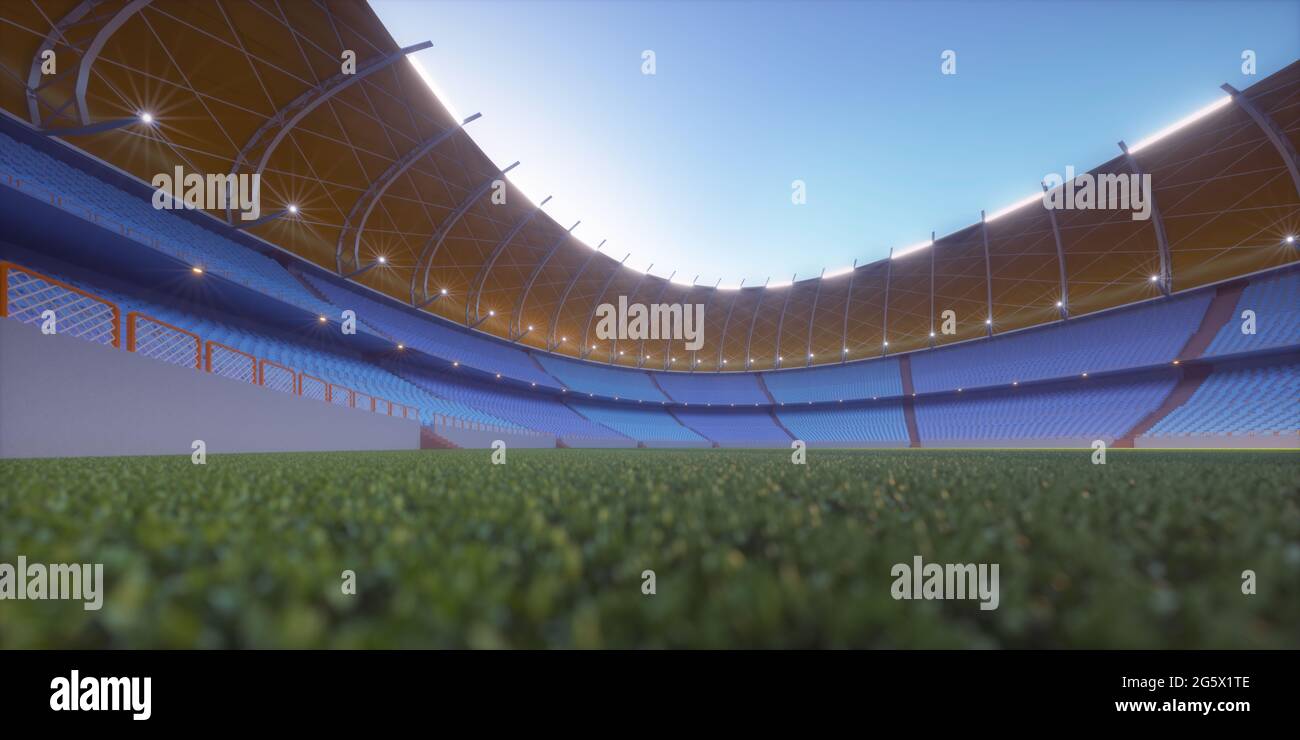 Fußballplatz im Sportstadion. Rasen beleuchtet in der Mitte durch die umliegenden Lichter. Stockfoto