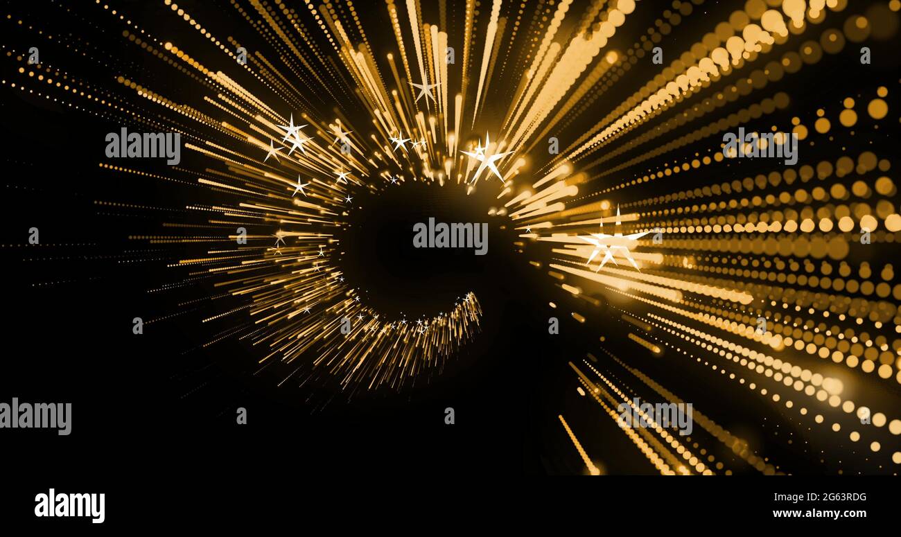 Bild von leuchtenden Flecken mit Lichtspuren und Sternen, die sich in hypnotischer Bewegung auf schwarzem Hintergrund bewegen Stockfoto