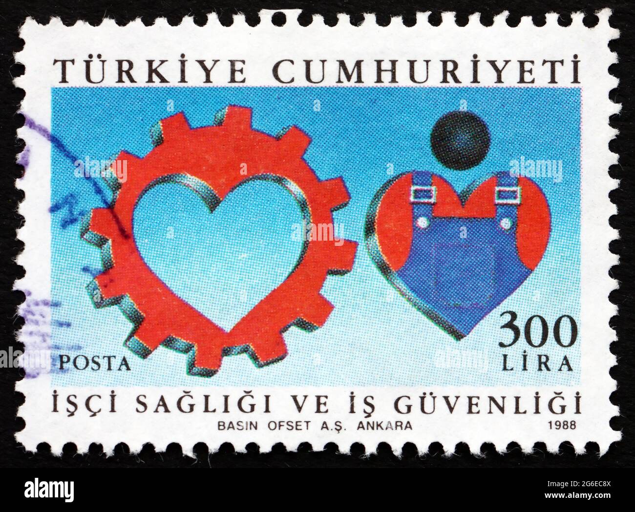 TÜRKEI - UM 1988: Eine in der Türkei gedruckte Marke zeigt sichere Arbeitsbedingungen, um 1988 Stockfoto