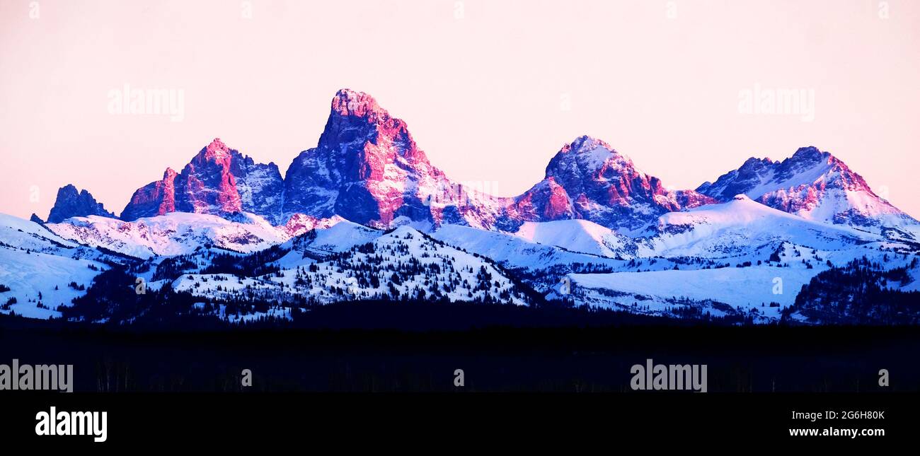 Sonnenuntergang mit alpen-leuchten auf den Tetons Tetons Bergen zerklüftet Stockfoto