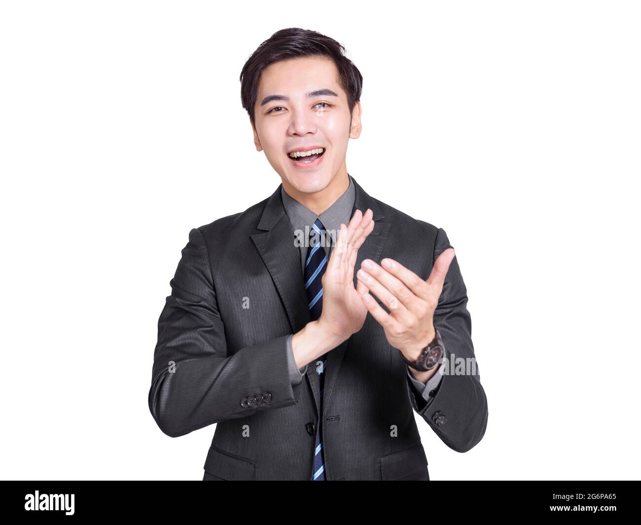 Der junge, gutaussehende Geschäftsmann applaudiert begeistert. Stockfoto