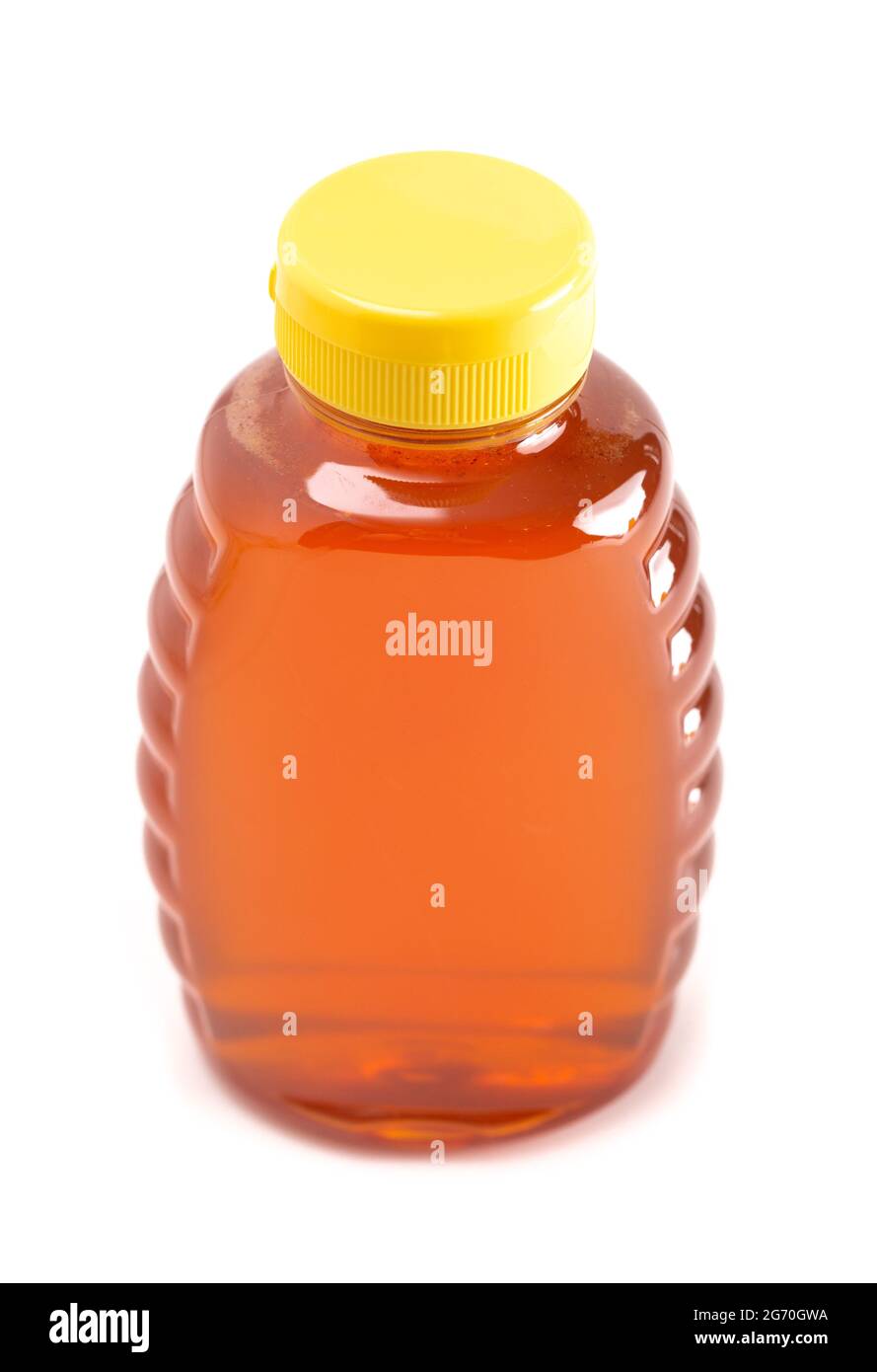Ein Glas rohen natürlichen Honigs auf weißem Hintergrund isoliert Stockfoto