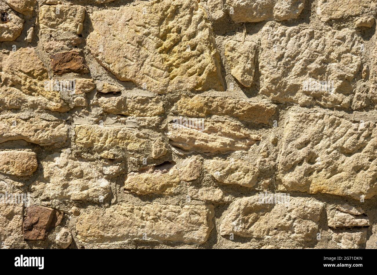 Struktur, Muster, Textur, Hintergrund, Abschnitt einer Steinmauer. Stockfoto