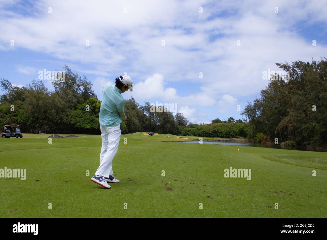 Erfassen Sie einen Golfspieler in ihrem Schwung Stockfoto