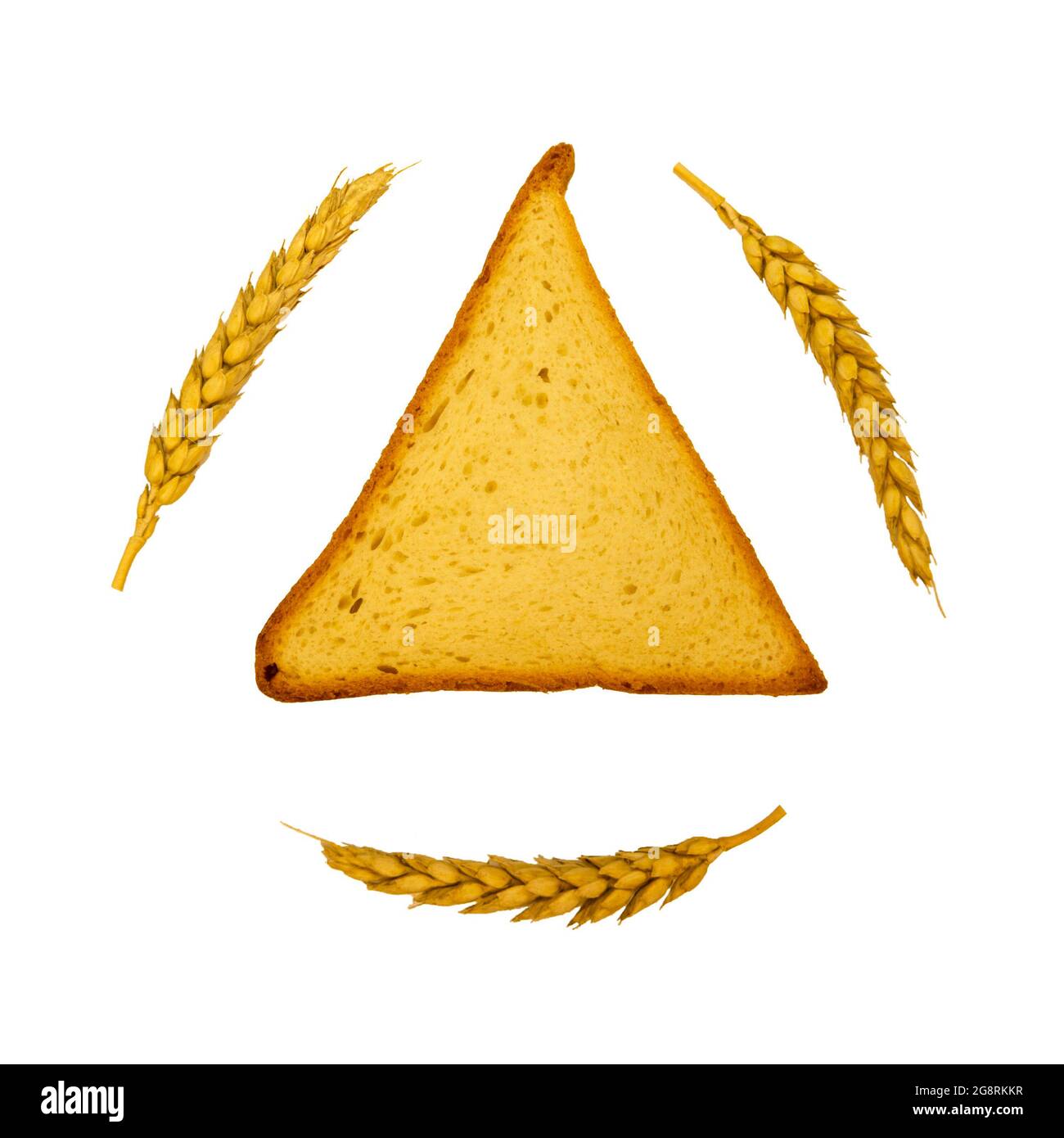 Dreieckiges Stück Brot für ein Sandwich mit Weizenspitz. Herbsternte von Roggen und Weizen. Stockfoto