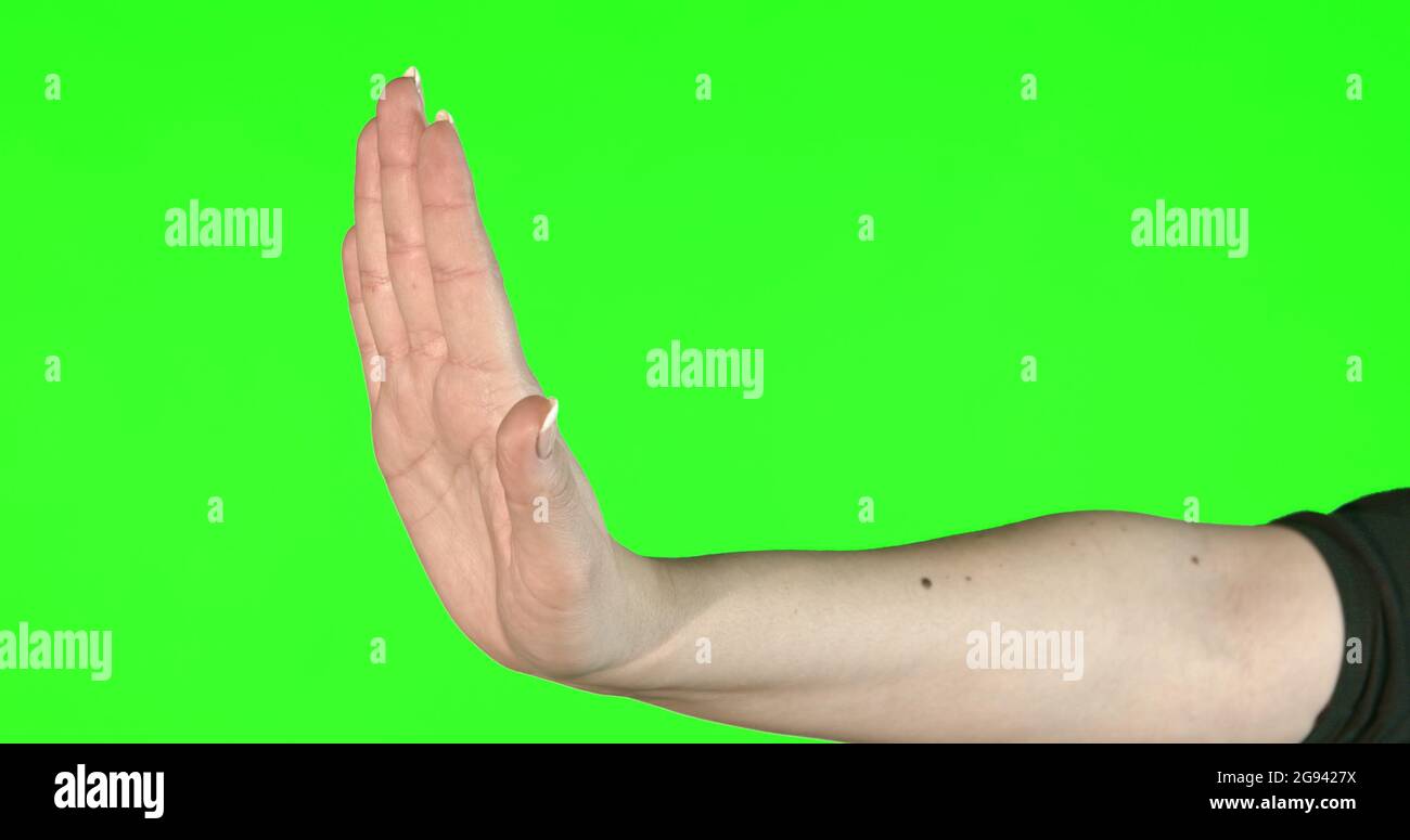 Weibliche Handgesten auf grünem Bildschirm: Nein Stockfoto
