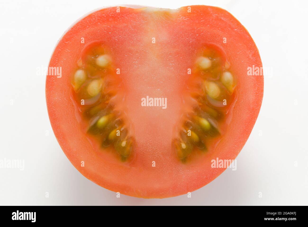 Tomate auf weißem Hintergrund teilen Stockfoto
