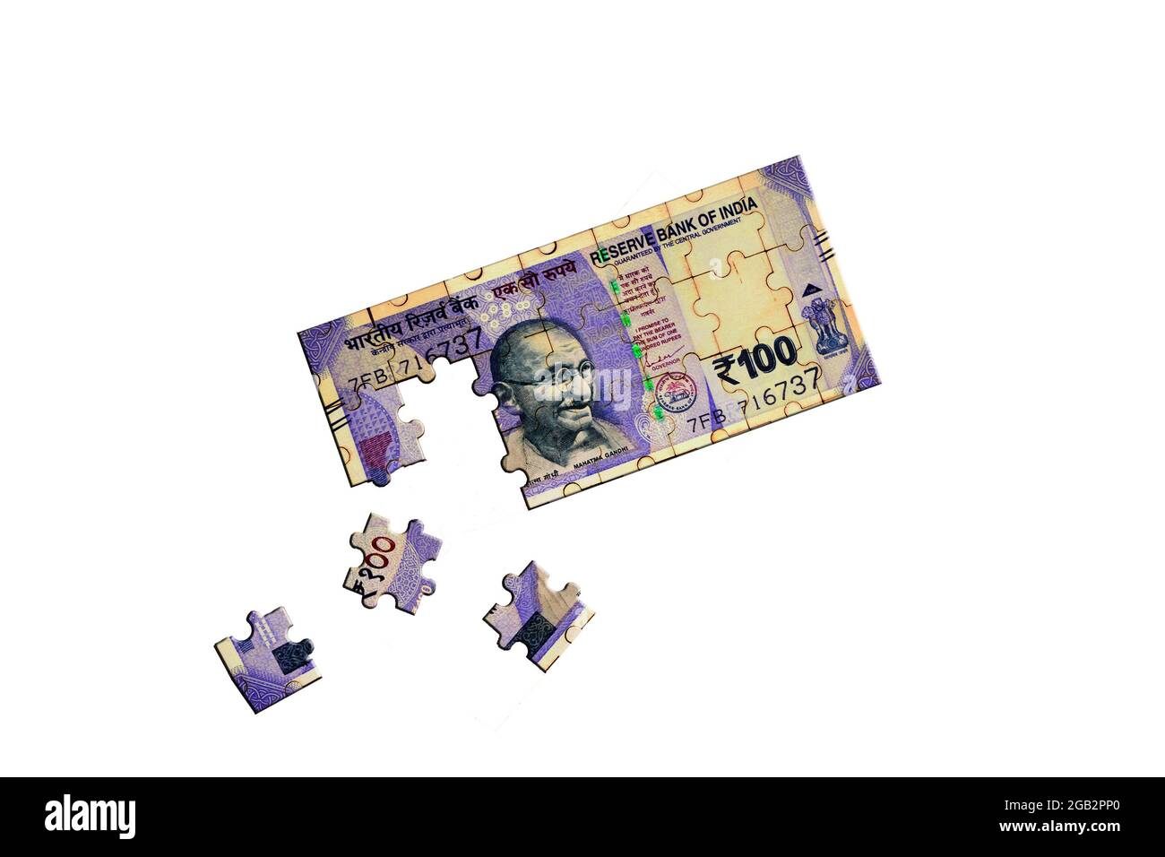 Hundert indische Währung Puzzle mit drei Teilen bewegt auf isolierten weißen Hintergrund Stockfoto