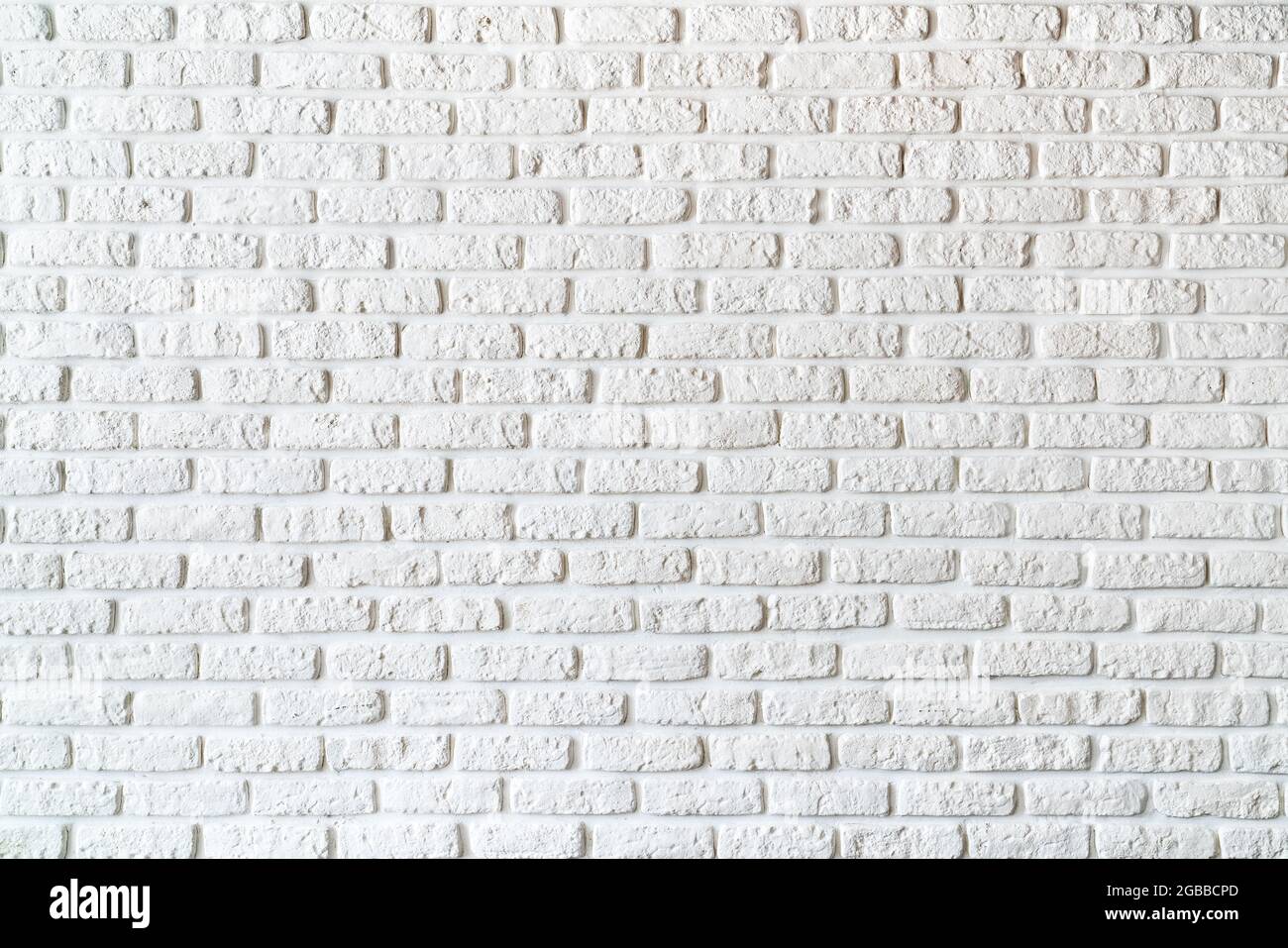 Weiß bemalte Ziegel auf der Wanddekoration für den Hintergrund. Hochwertige Fotos Stockfoto