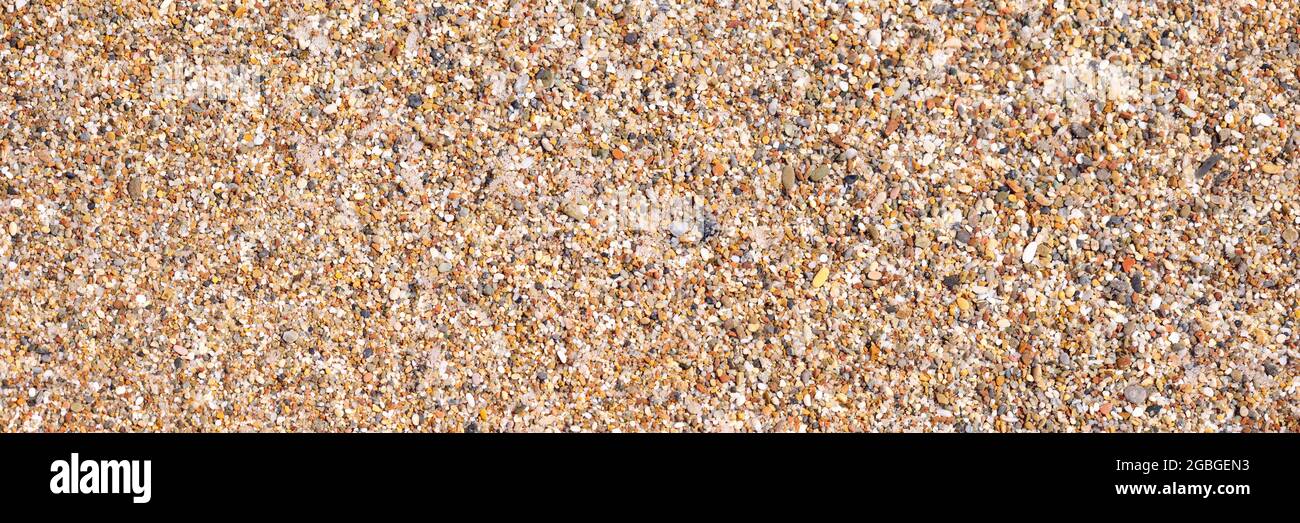 Struktur aus Steinen und Sand am Strand Stockfoto
