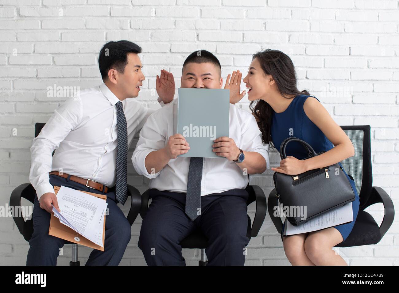 Geschäftsleute, die Klatsch reden Stockfoto
